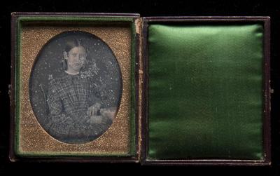 Young woman in a tartan dress daguerreotype,  undated