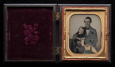 Seated man holding child ambrotype, undated