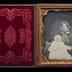 Seated woman holding a baby daguerreotype, undated