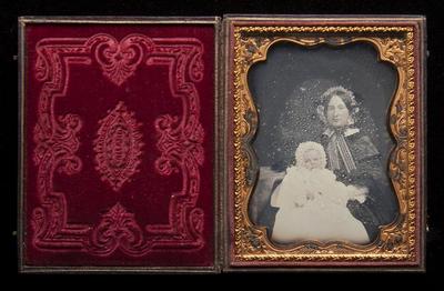 Seated woman holding a baby daguerreotype, undated