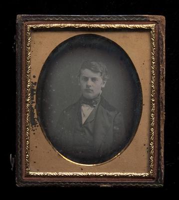 Young man wearing upturned collar